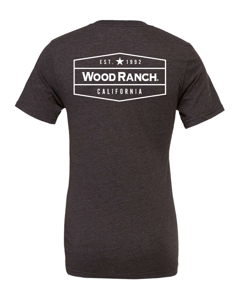 About the product. Backside of dark grey jersey style garment. White Wood Ranch emblem logo in the center.