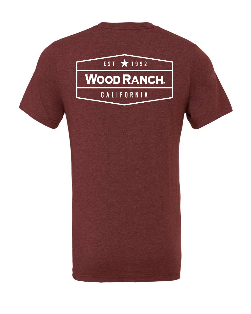About the product. Backside of cardinal red jersey style garment. White Wood Ranch emblem logo in the center.