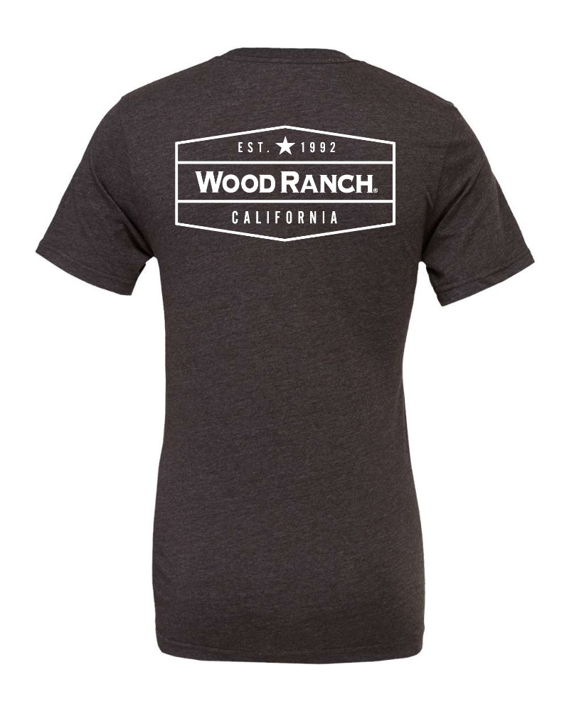 About the product. Backside of dark grey jersey style garment. White Wood Ranch emblem logo in the center. 